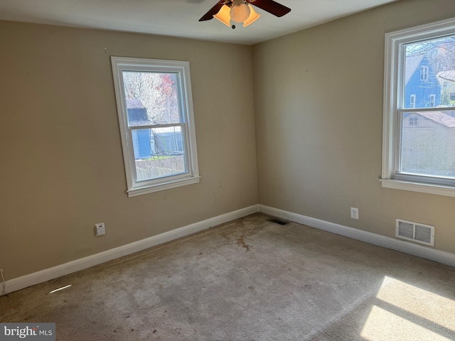 carpeted empty room with ceiling fan