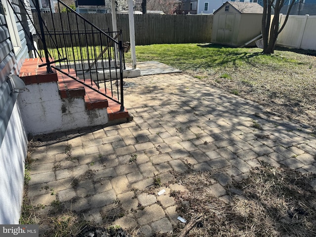 view of patio / terrace featuring a storage shed