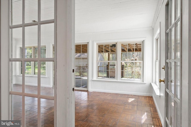 unfurnished sunroom with french doors and a wealth of natural light