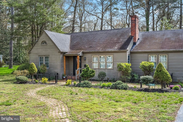 cape cod-style house with a front lawn