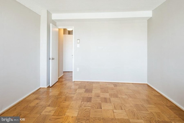 empty room with light parquet floors