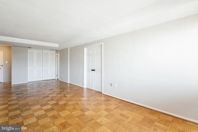 unfurnished room featuring light parquet floors