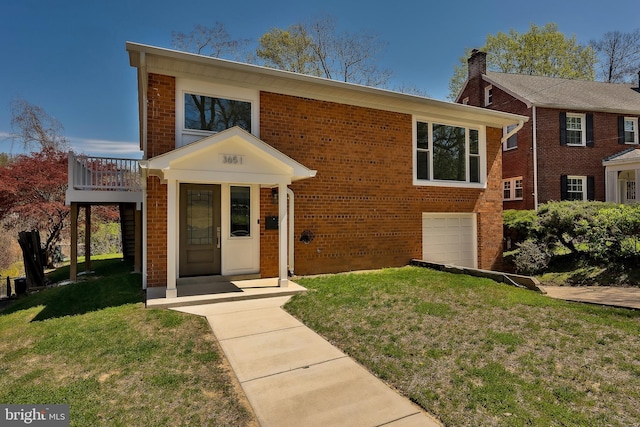 view of front of home with a garage and a front yard