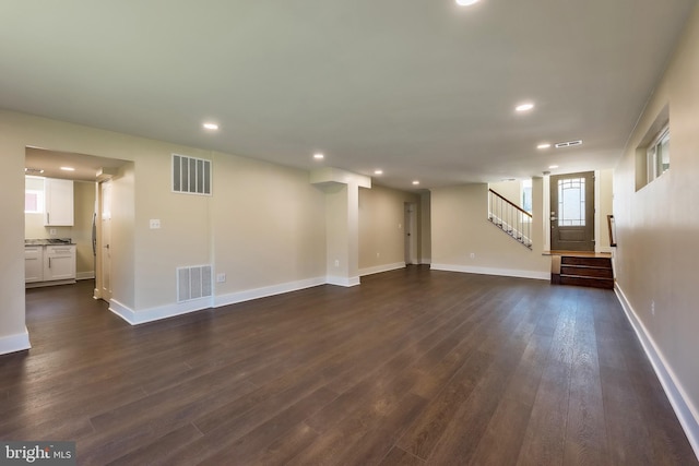 interior space with dark hardwood / wood-style flooring