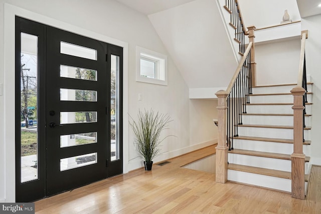 foyer with a wealth of natural light and light hardwood / wood-style floors