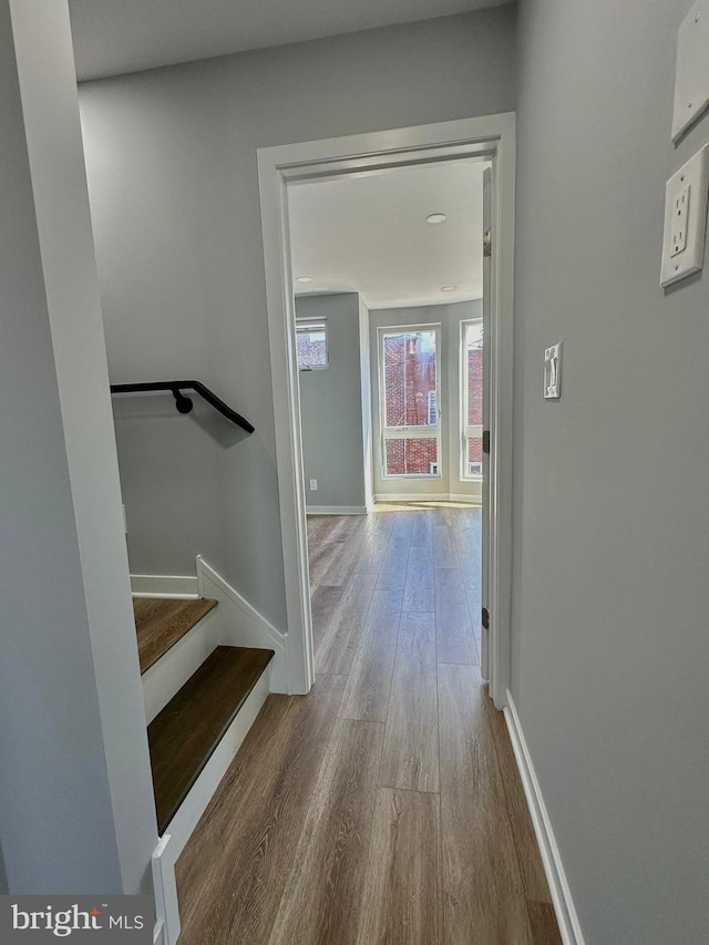 corridor with wood-type flooring