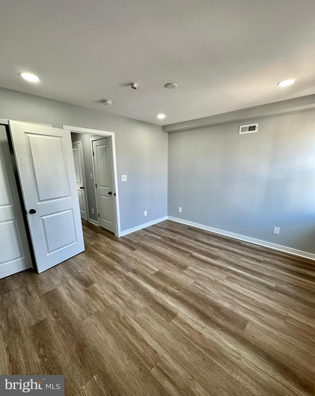 unfurnished bedroom featuring wood-type flooring