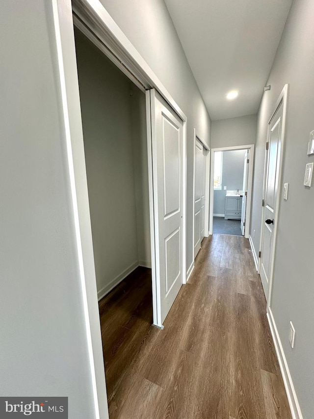 hall featuring dark wood-type flooring