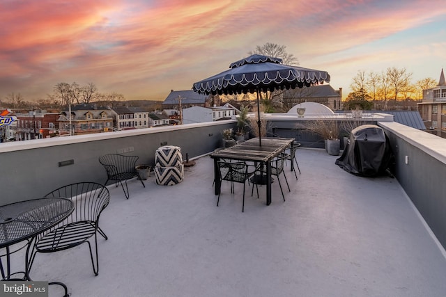 patio terrace at dusk with a balcony