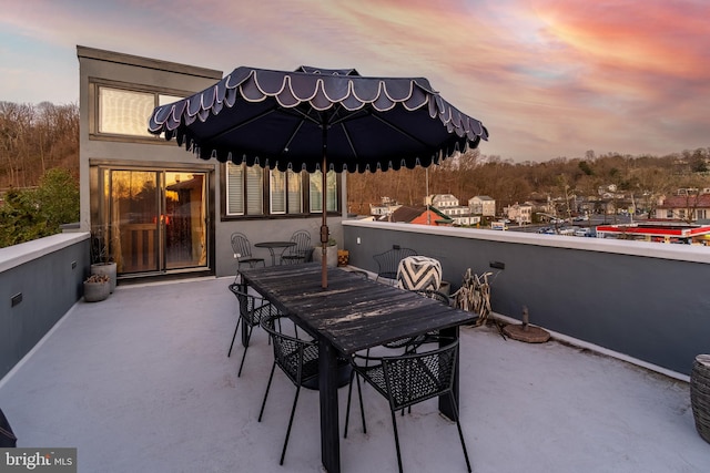 view of patio terrace at dusk