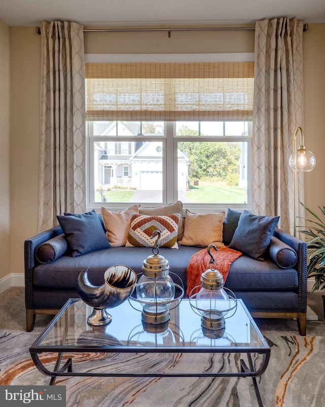 living room with carpet flooring and a wealth of natural light