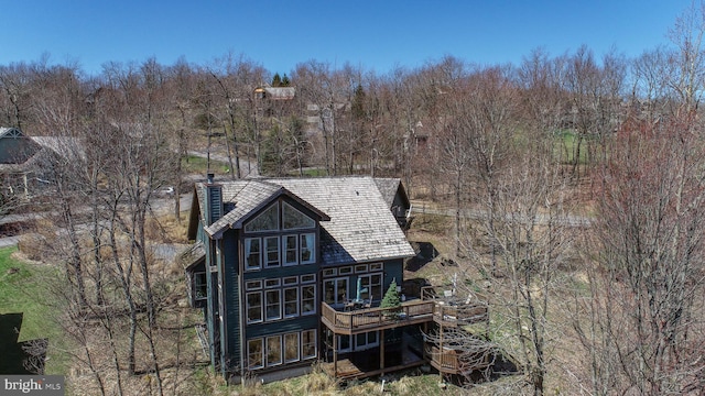 back of house with a wooden deck