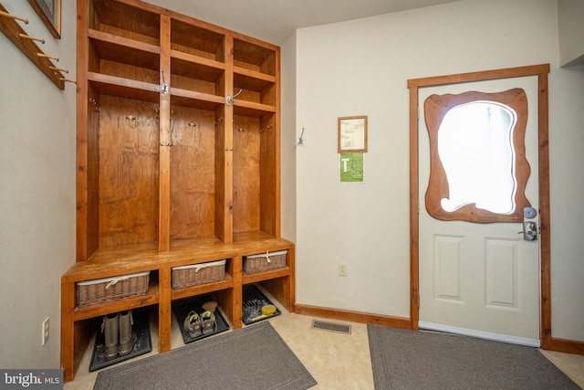 mudroom with carpet flooring