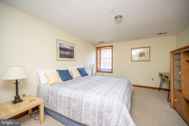 bedroom featuring light carpet