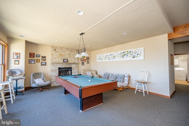 game room with carpet, a stone fireplace, billiards, and washer / clothes dryer