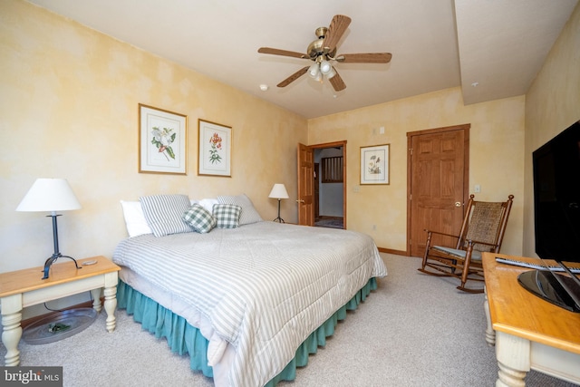 bedroom featuring ceiling fan and carpet floors