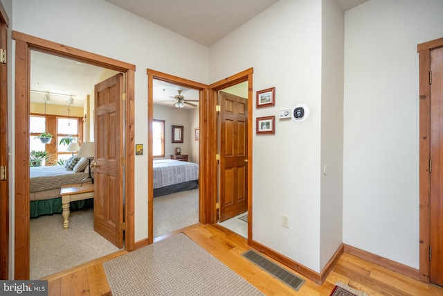 hallway with light wood-type flooring