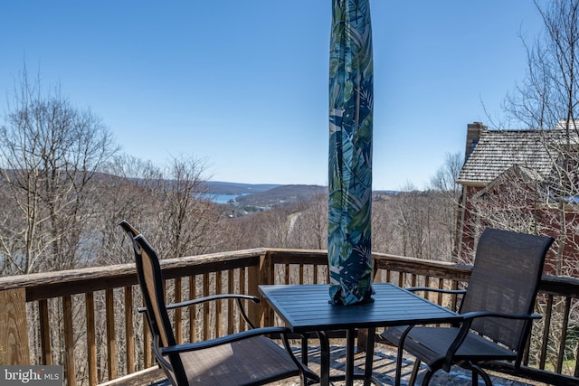 wooden deck featuring a mountain view