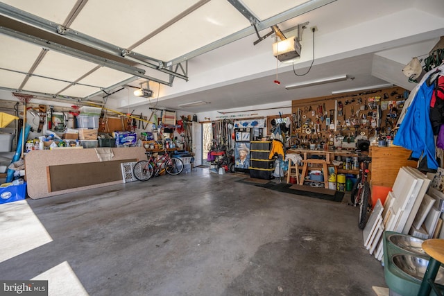 garage featuring a workshop area and a garage door opener