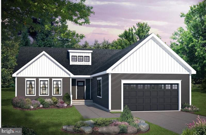 view of front facade with a lawn and a garage