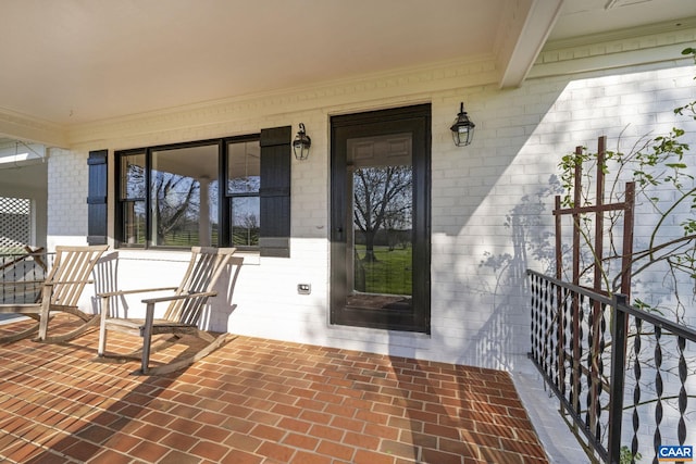 entrance to property featuring covered porch