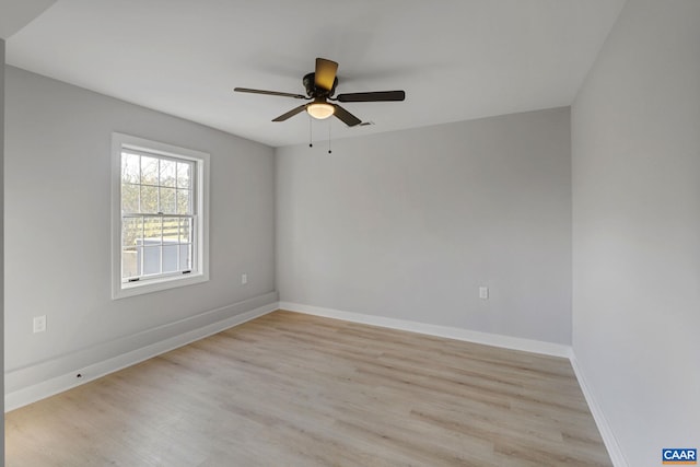 empty room featuring ceiling fan and light hardwood / wood-style flooring