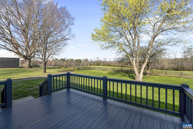 wooden terrace featuring a lawn