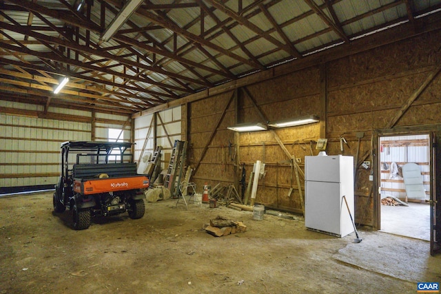 garage featuring white fridge