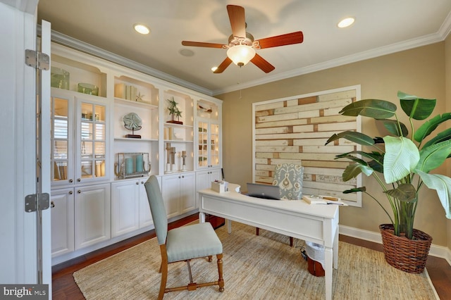 office with ceiling fan, crown molding, and light hardwood / wood-style floors