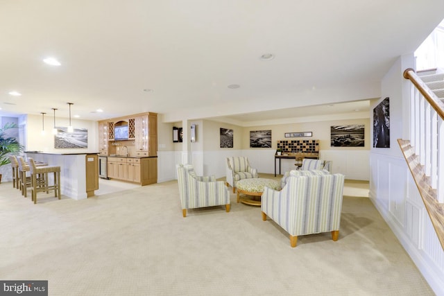 living room featuring light colored carpet and sink