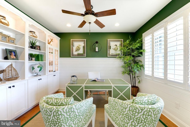 sitting room featuring plenty of natural light, light hardwood / wood-style floors, and ceiling fan