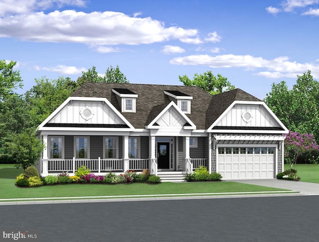 view of front of home featuring a porch, a front lawn, and a garage