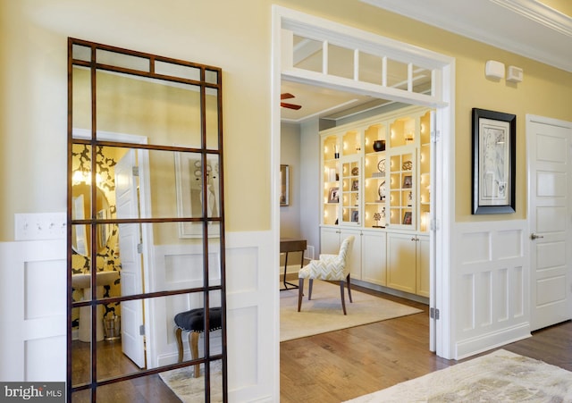 interior space with dark hardwood / wood-style floors and ornamental molding