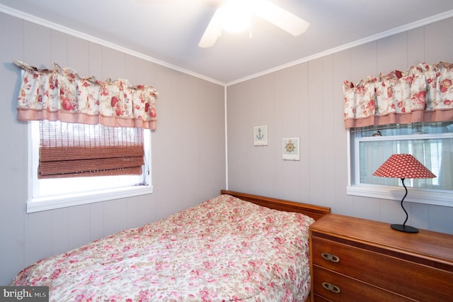 bedroom featuring ornamental molding and ceiling fan