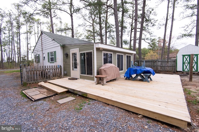 wooden deck featuring a shed