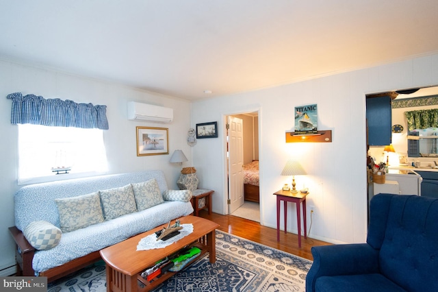 living room featuring a wall mounted air conditioner and light wood-type flooring