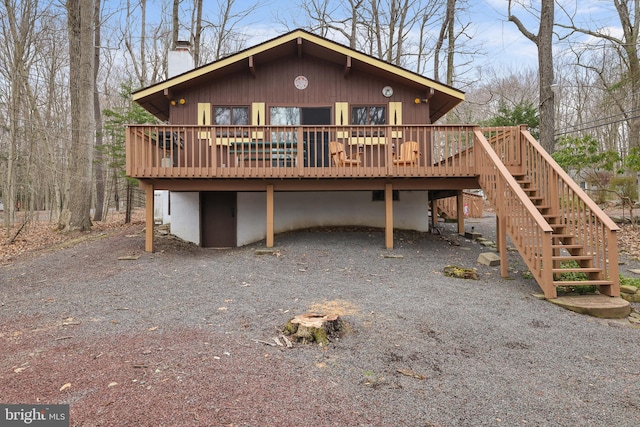 back of house featuring a deck