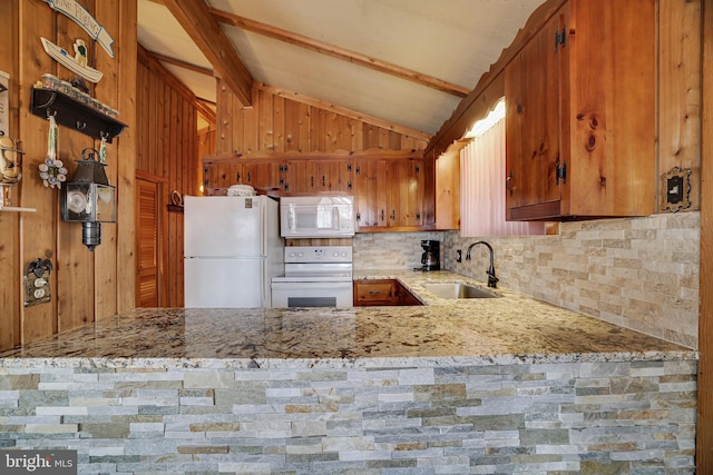 kitchen featuring light stone counters, vaulted ceiling with beams, sink, white appliances, and backsplash