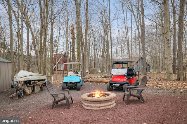 view of terrace featuring an outdoor fire pit