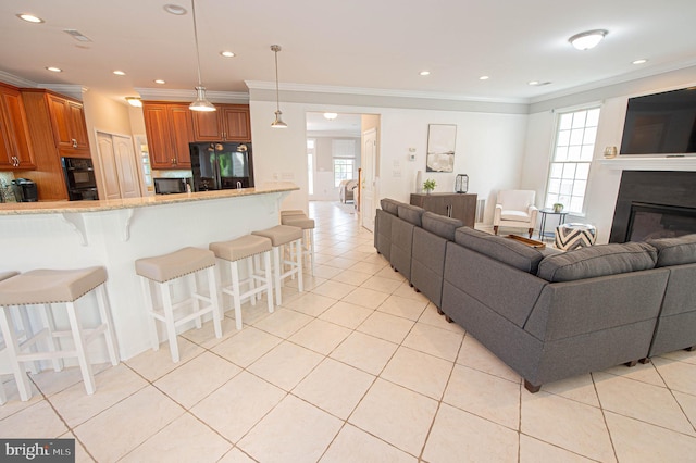 tiled living room featuring ornamental molding