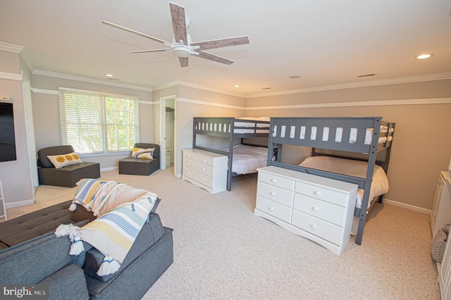 carpeted bedroom with ceiling fan and crown molding