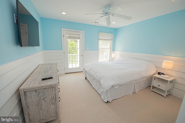 carpeted bedroom featuring access to outside and ceiling fan