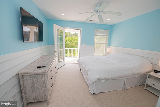 carpeted bedroom featuring access to exterior and ceiling fan