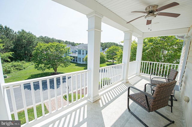 balcony with ceiling fan and a porch