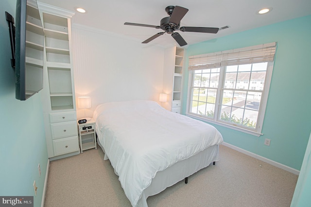 bedroom featuring light colored carpet and ceiling fan