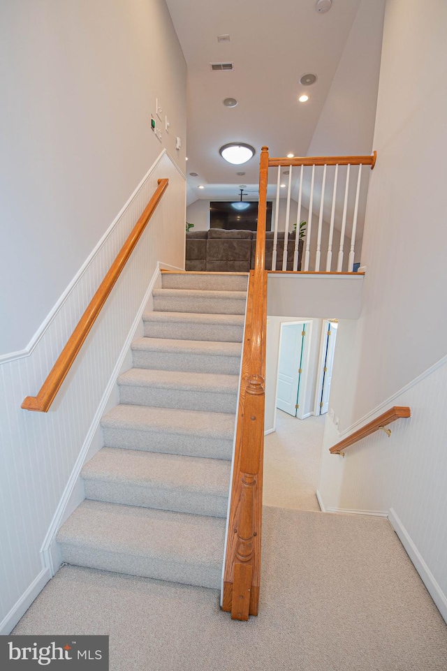 stairs featuring carpet