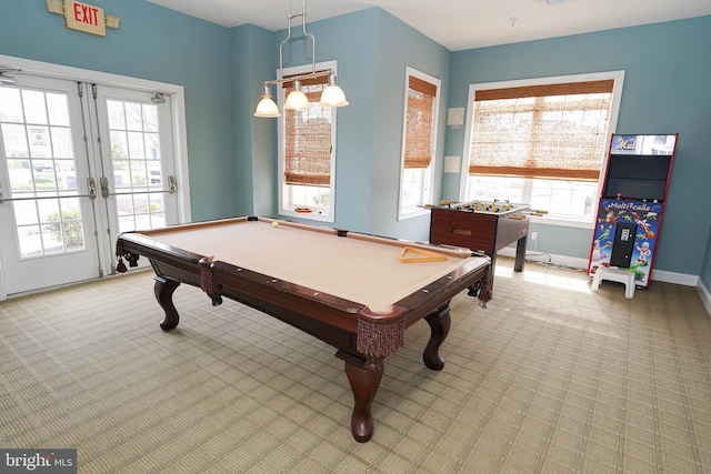 recreation room featuring carpet flooring, french doors, a healthy amount of sunlight, and billiards