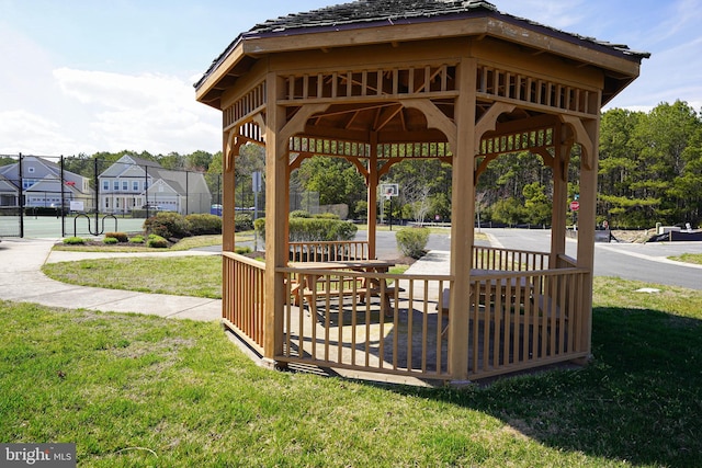 surrounding community with a gazebo and a lawn