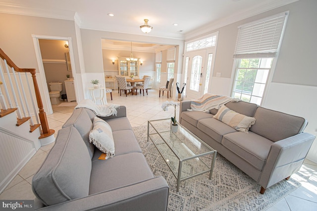 living room with light tile patterned flooring and ornamental molding