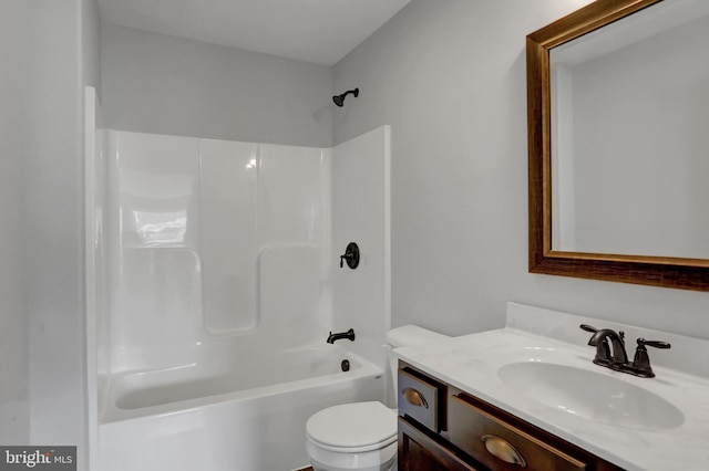 full bathroom with bathing tub / shower combination, toilet, and oversized vanity